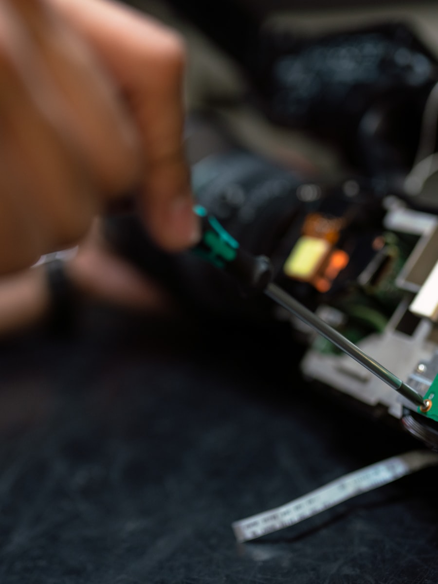 A technician repairing a hydraulic hose on site