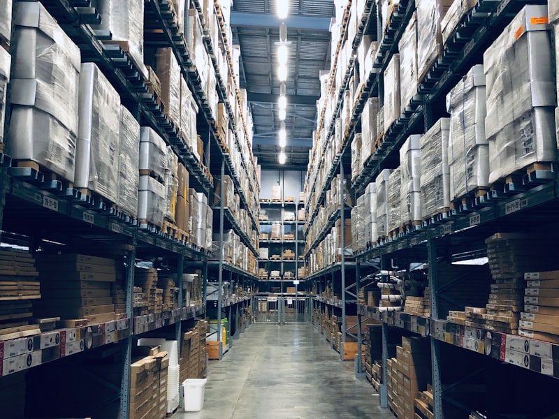 A wall of labelled storage bins in a Rubix warehouse.