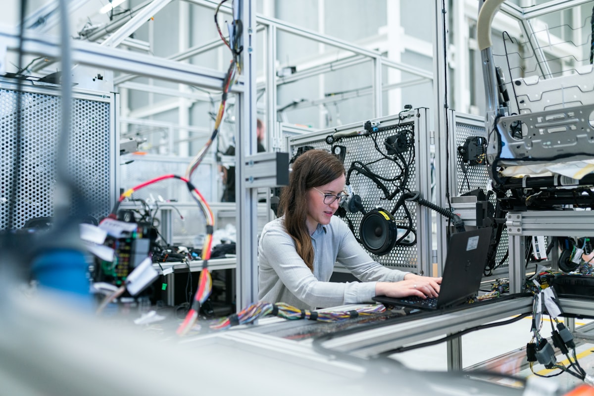 Two Rubix technicians examining a part in a machining centre.